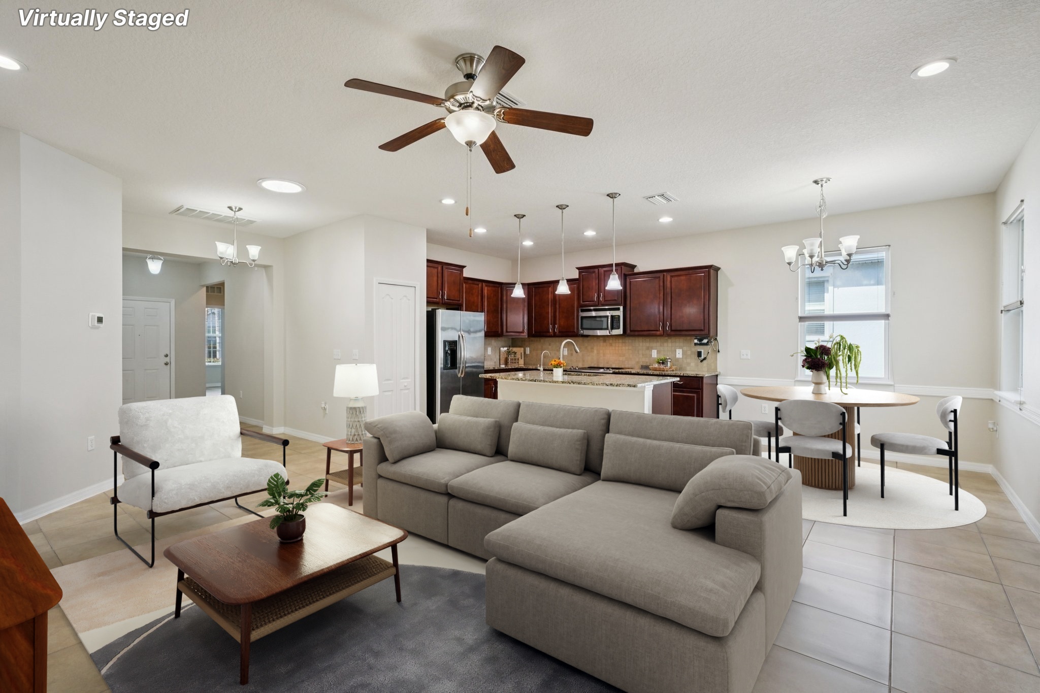 Spacious open living and dining area with high ceilings in this Summertree 55+ home for sale