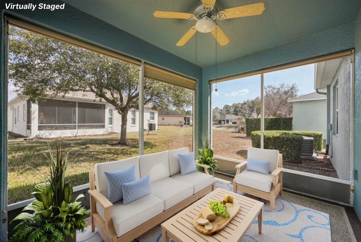 Screened lanai perfect for morning coffee at 11129 Kiskadee Cir in Summertree, New Port Richey FL