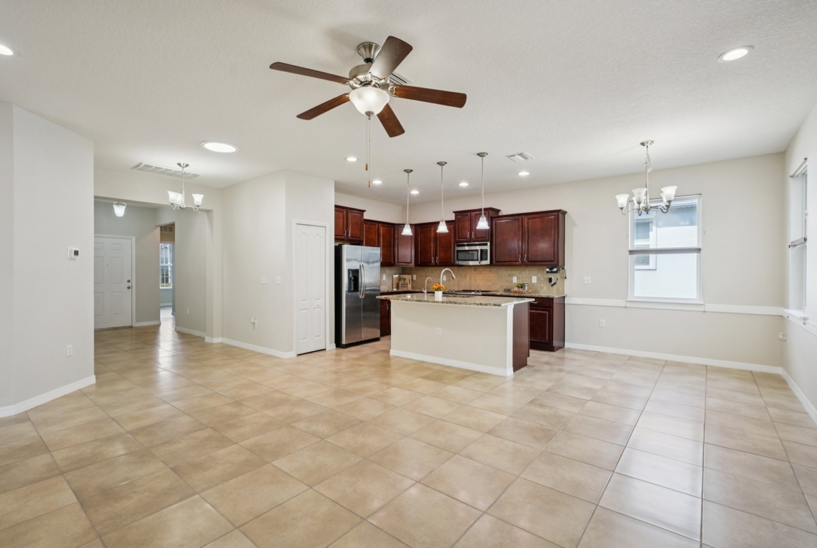 Great room with kitchen family room combo layout at 11129 Kiskadee Cir, New Port Richey FL 34654