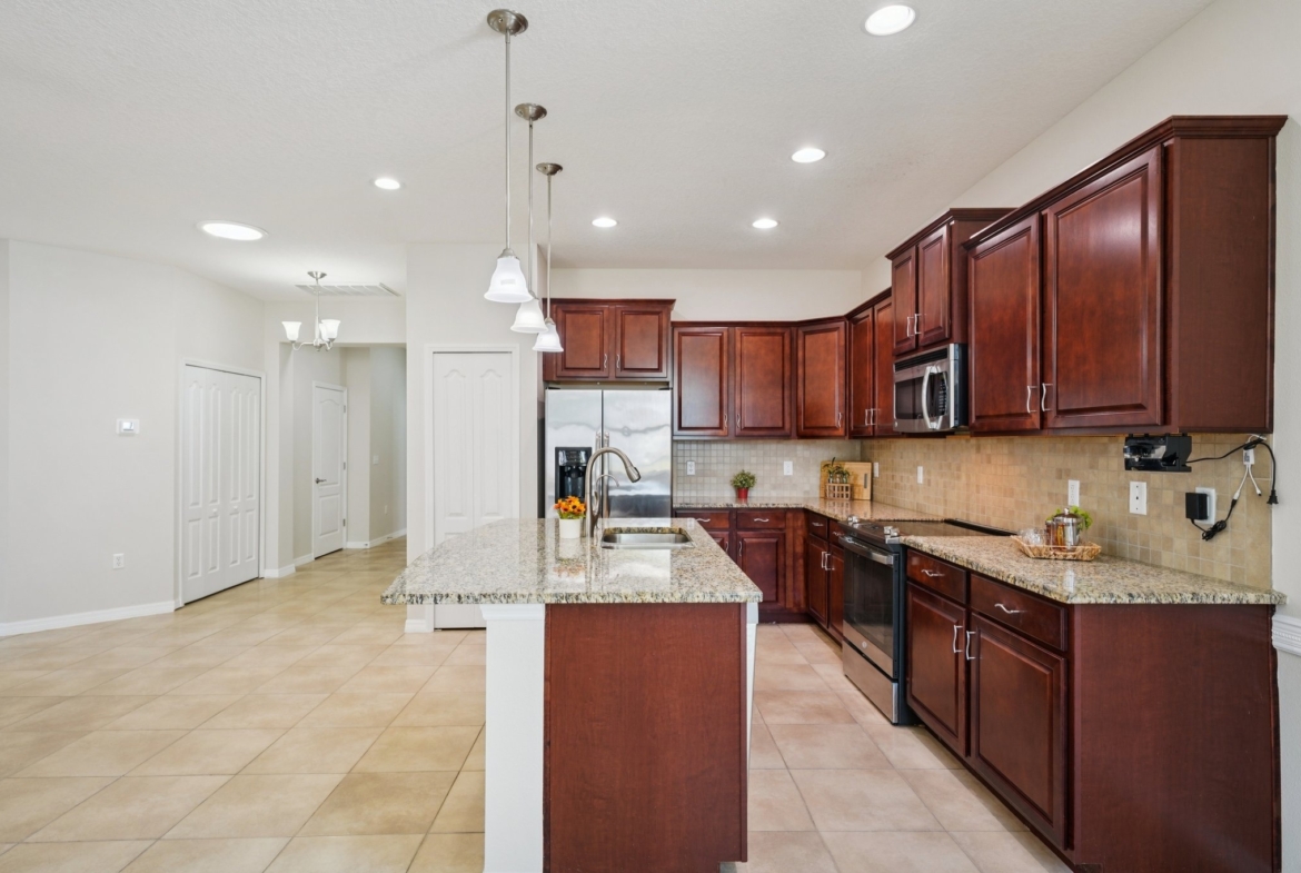 Kitchen with breakfast bar seating and custom shelving in lower cabinets, New Port Richey FL