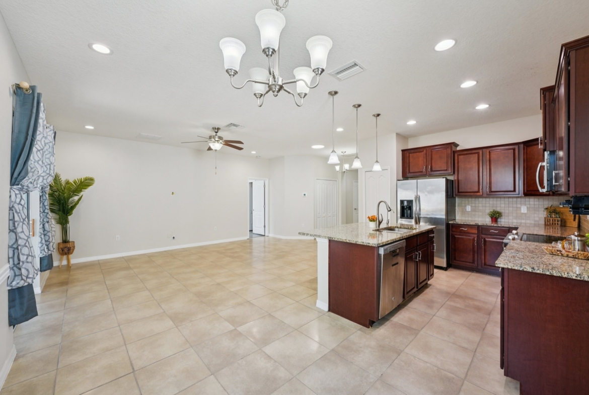 Dining area open to the kitchen at 11129 Kiskadee Cir, New Port Richey FL 34654