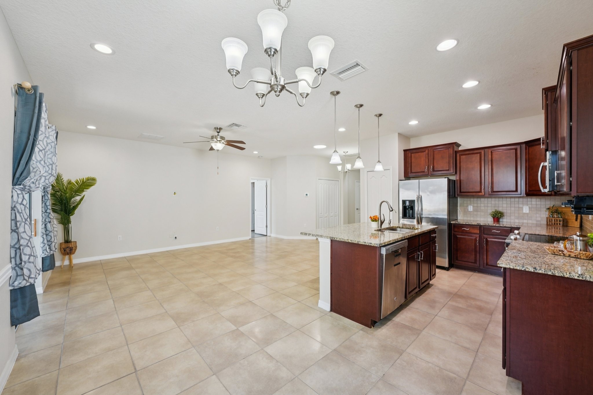 Dining area open to the kitchen at 11129 Kiskadee Cir, New Port Richey FL 34654