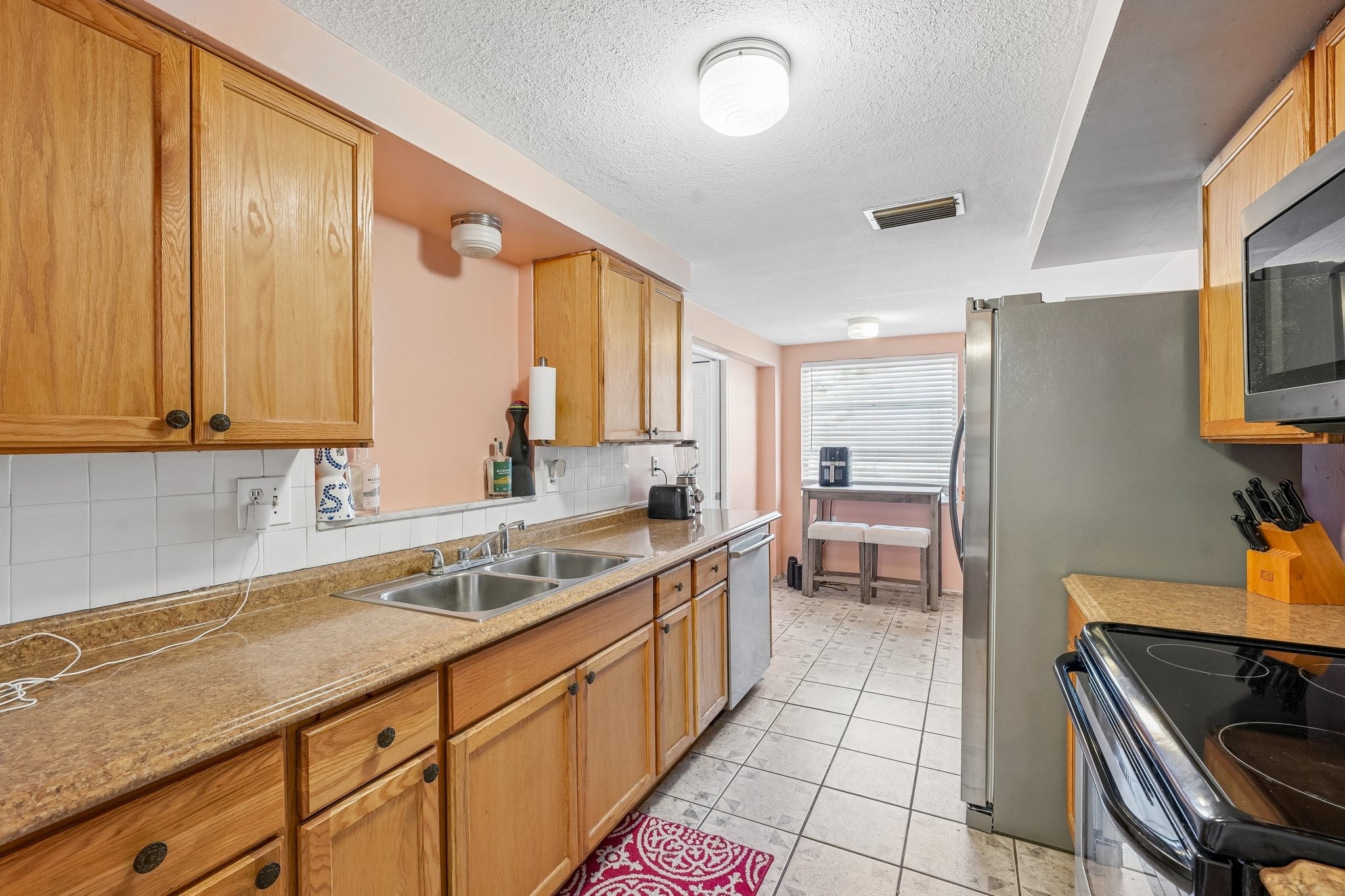Updated kitchen with Bosch, Frigidaire and Whirlpool appliances at 1133 Grand Blvd, Holiday FL 34690