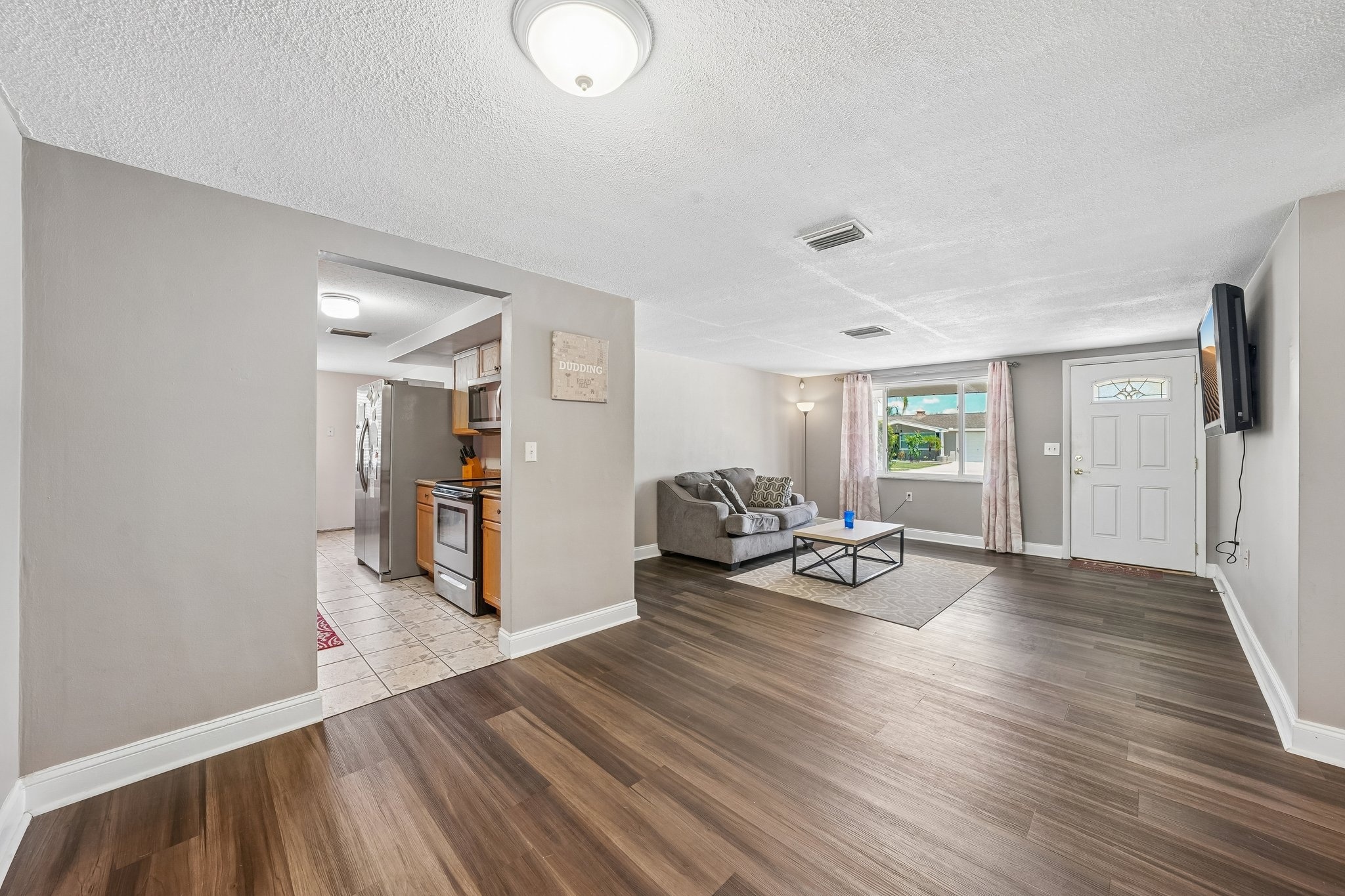 Bright living area with natural light at 1133 Grand Blvd, a 3 bedroom waterfront home in Holiday FL