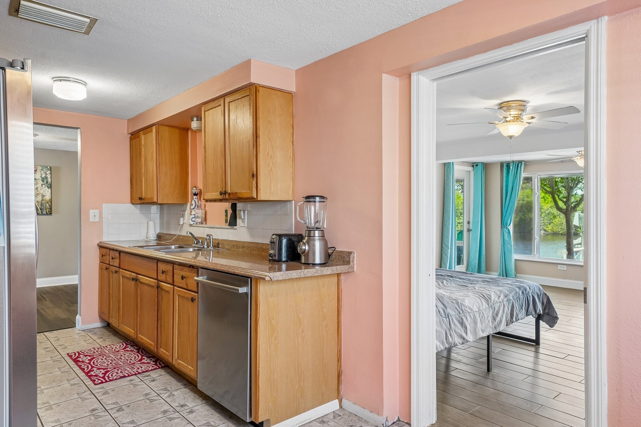 Eat-in kitchen with dishwasher and stone counters at 1133 Grand Blvd, Holiday FL