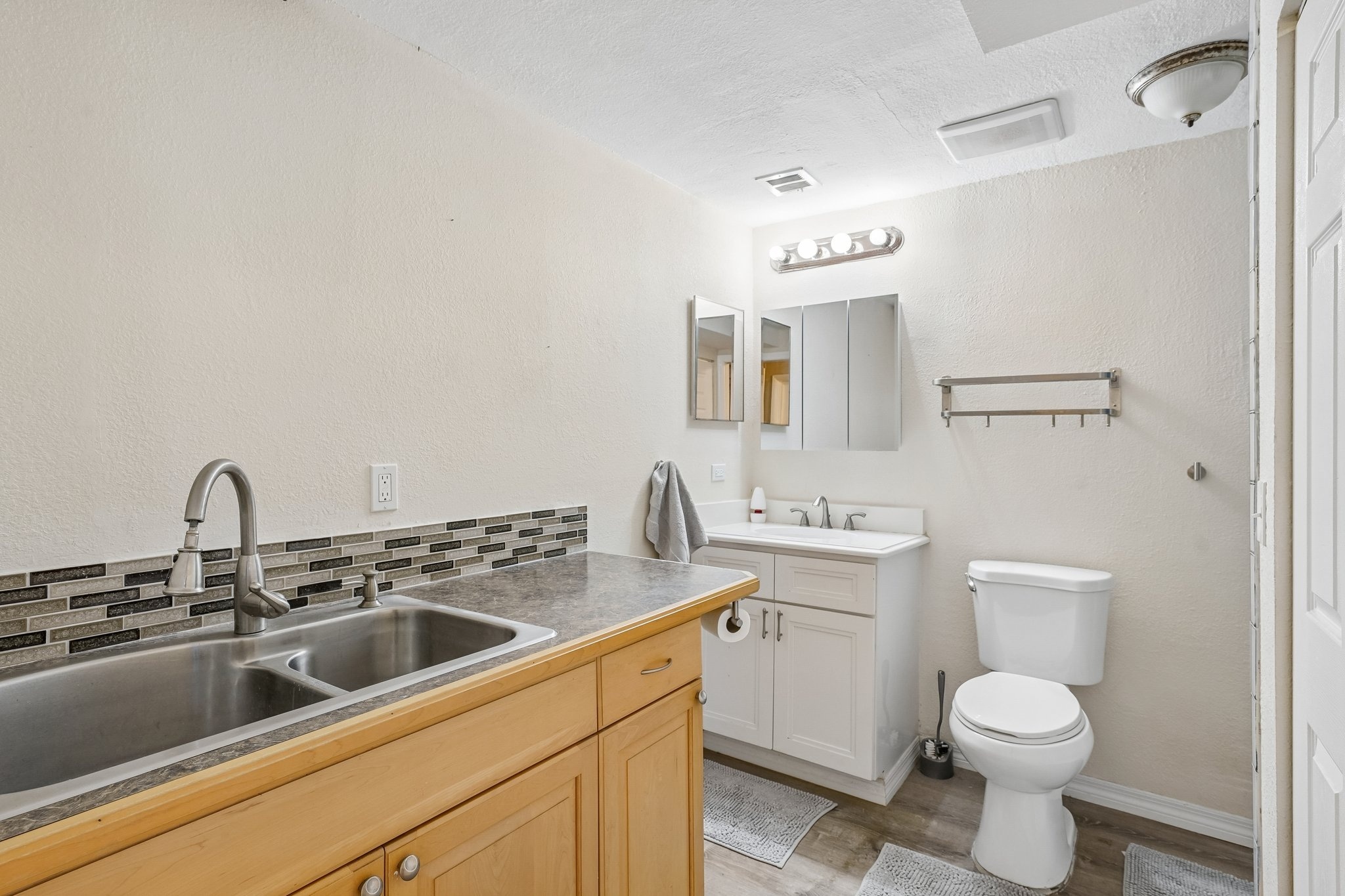 Completely renovated bathroom with double sink vanity and modern fixtures, Holiday FL