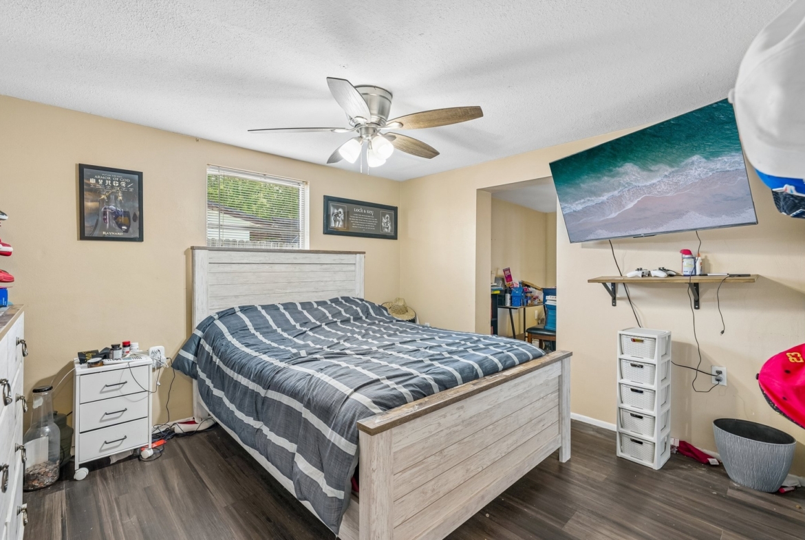 Second bedroom with ceiling fan at 1133 Grand Blvd, a 3 bedroom waterfront home in Holiday FL 34690