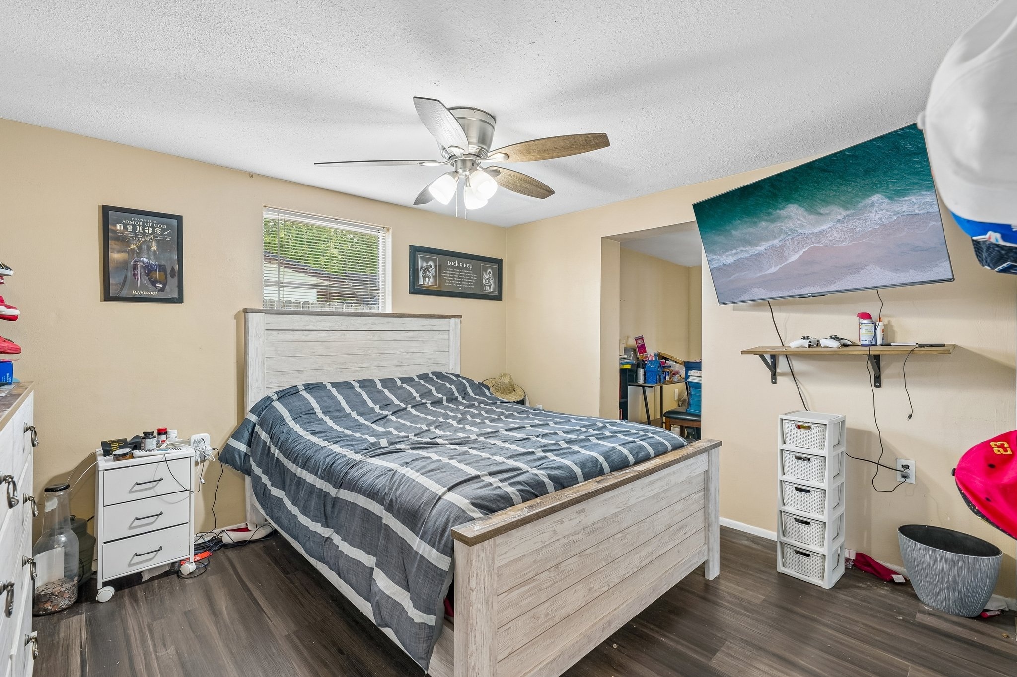 Second bedroom with ceiling fan at 1133 Grand Blvd, a 3 bedroom waterfront home in Holiday FL 34690