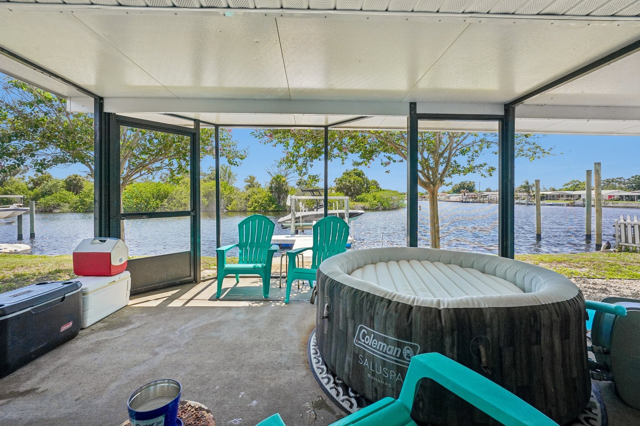 Screened lanai with hot tub overlooking the Anclote River at 1133 Grand Blvd, Holiday FL