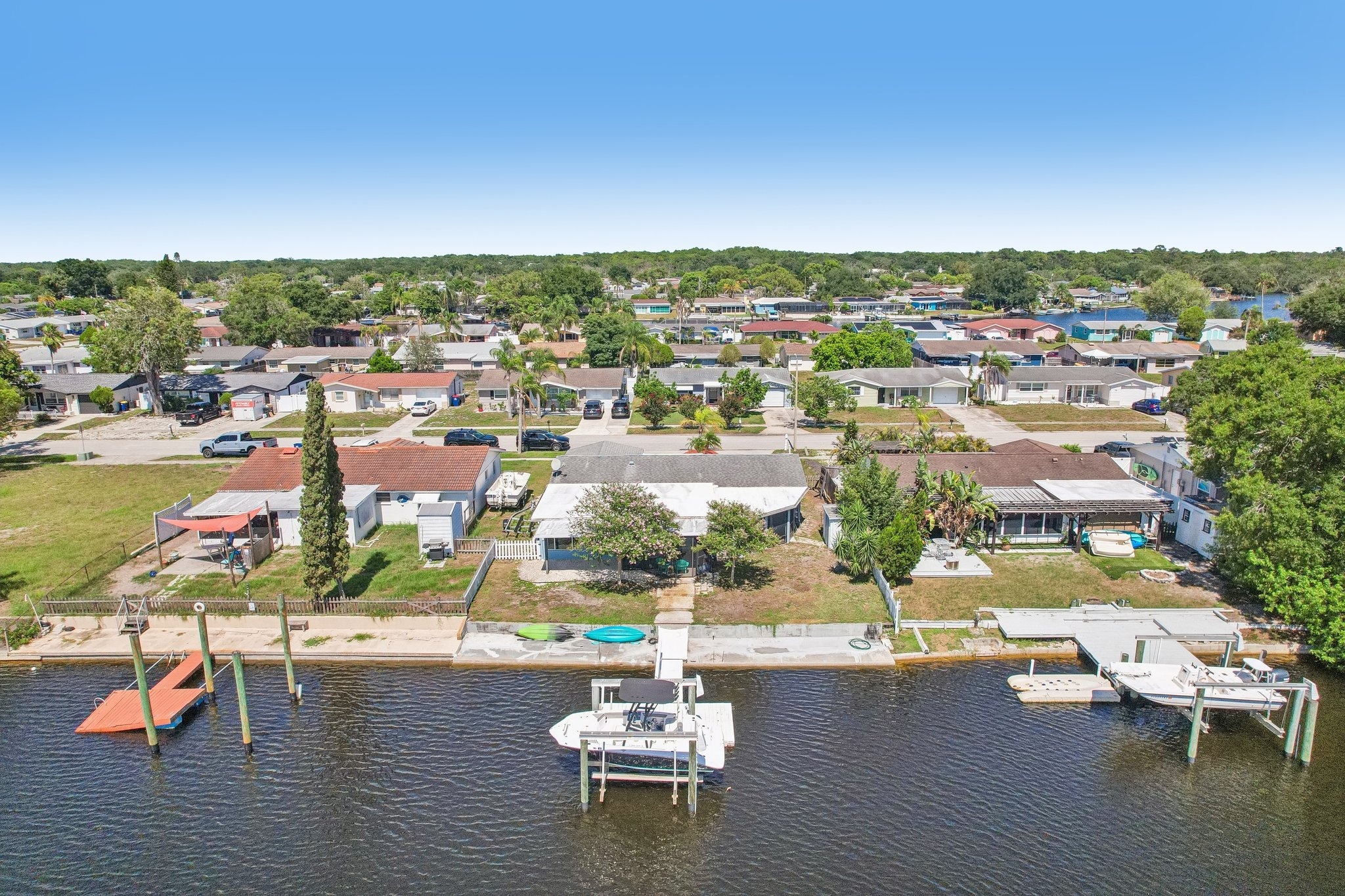Aerial of the home, private dock and boat lift on the water in Holiday, FL 34690