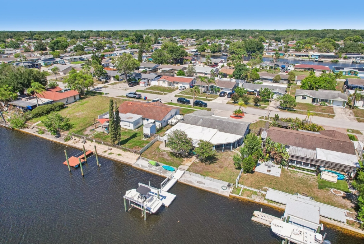 Aerial of neighboring docks and boats along the canal in Forest Hills, Holiday FL