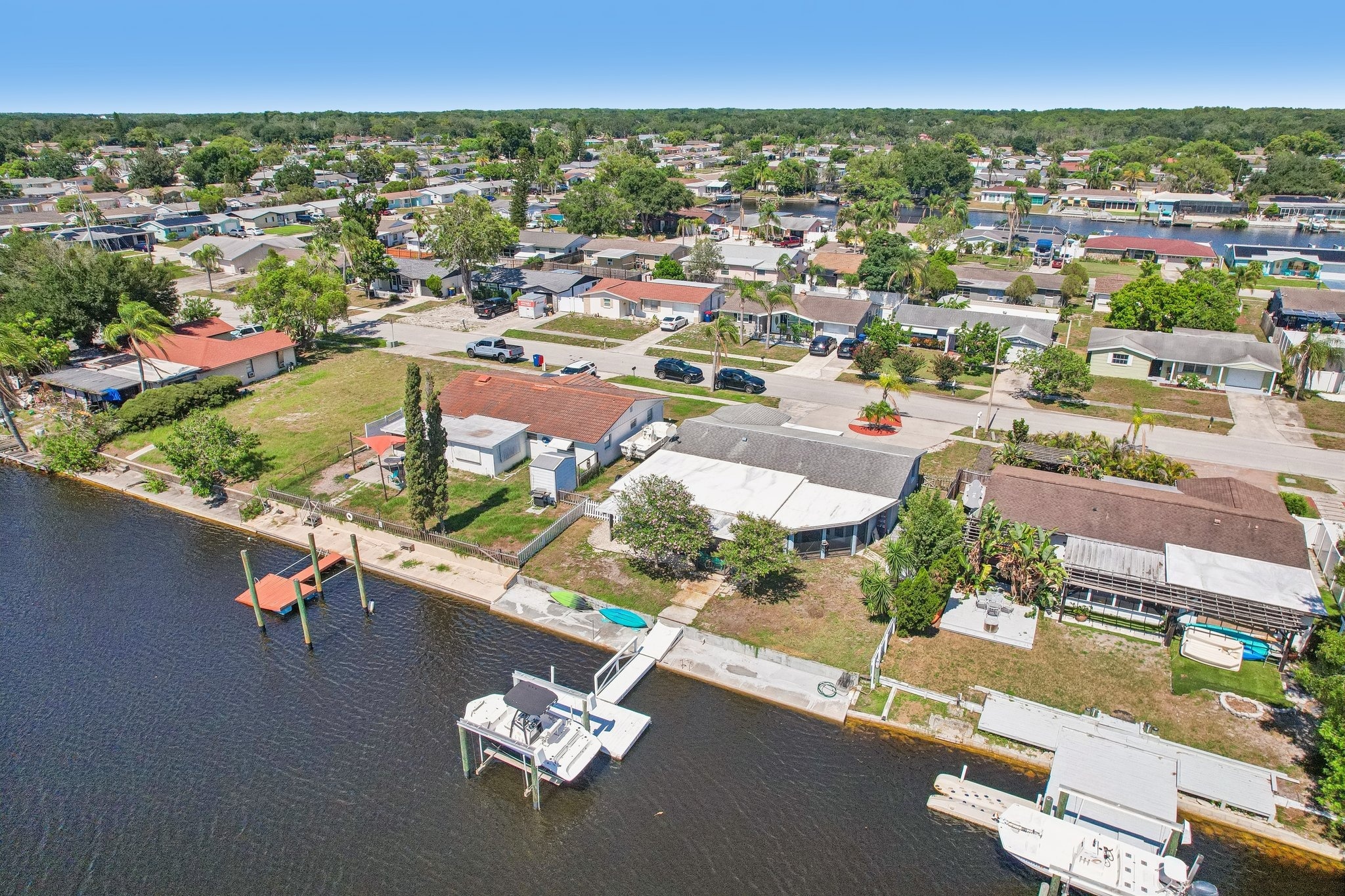 Aerial of neighboring docks and boats along the canal in Forest Hills, Holiday FL