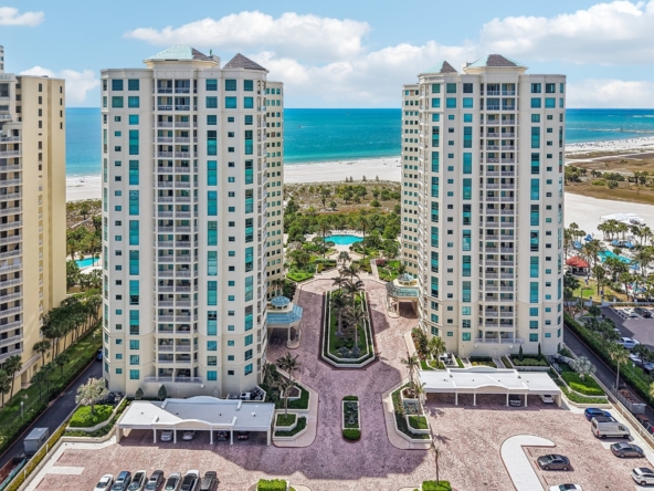 Aerial view of The Grande on Sand Key luxury condo towers on the Gulf of Mexico in Clearwater Beach, FL 33767