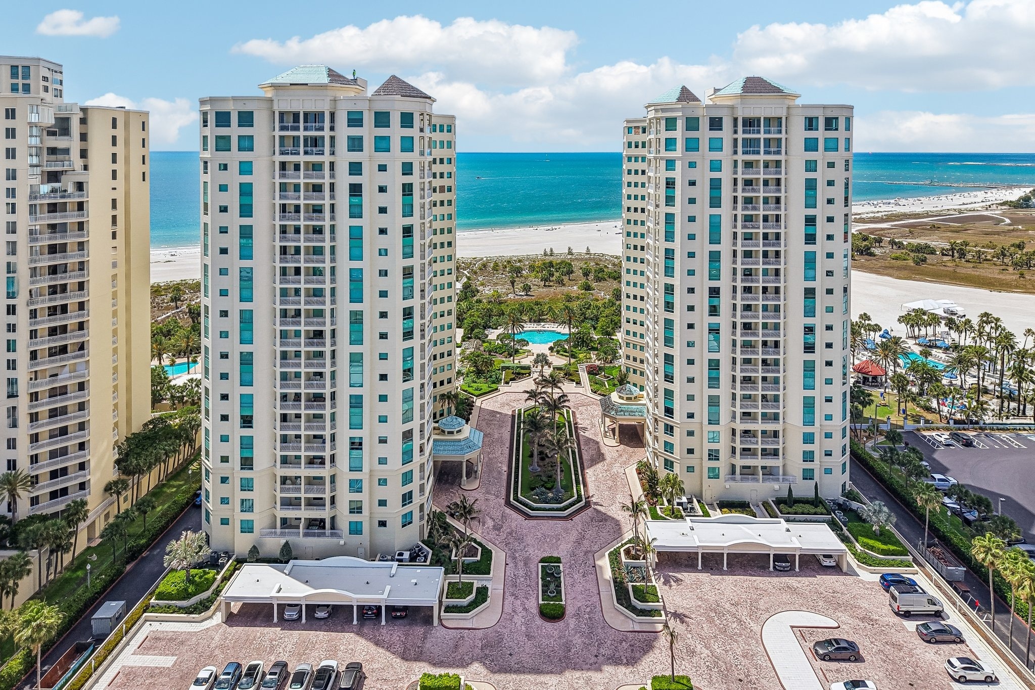 Aerial view of The Grande on Sand Key luxury condo towers on the Gulf of Mexico in Clearwater Beach, FL 33767