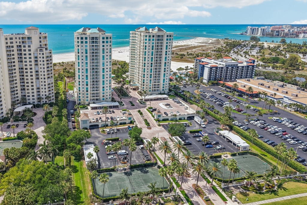 Aerial of Sand Key showing the Gulf of Mexico, the Intracoastal and The Grande condominium in Clearwater Beach FL