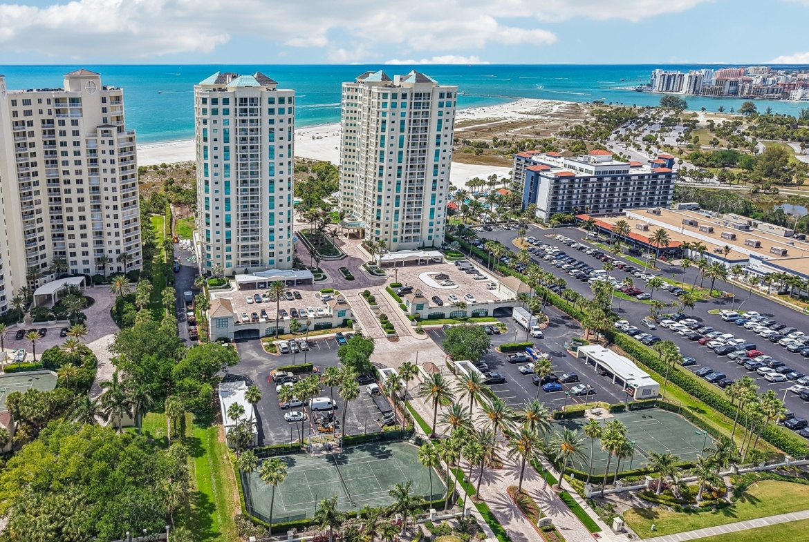 Aerial of Sand Key showing the Gulf of Mexico, the Intracoastal and The Grande condominium in Clearwater Beach FL