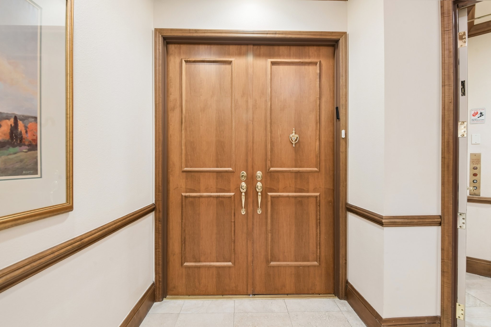 Grand double-door private entry to residence 101 at The Grande on Sand Key, Clearwater Beach FL