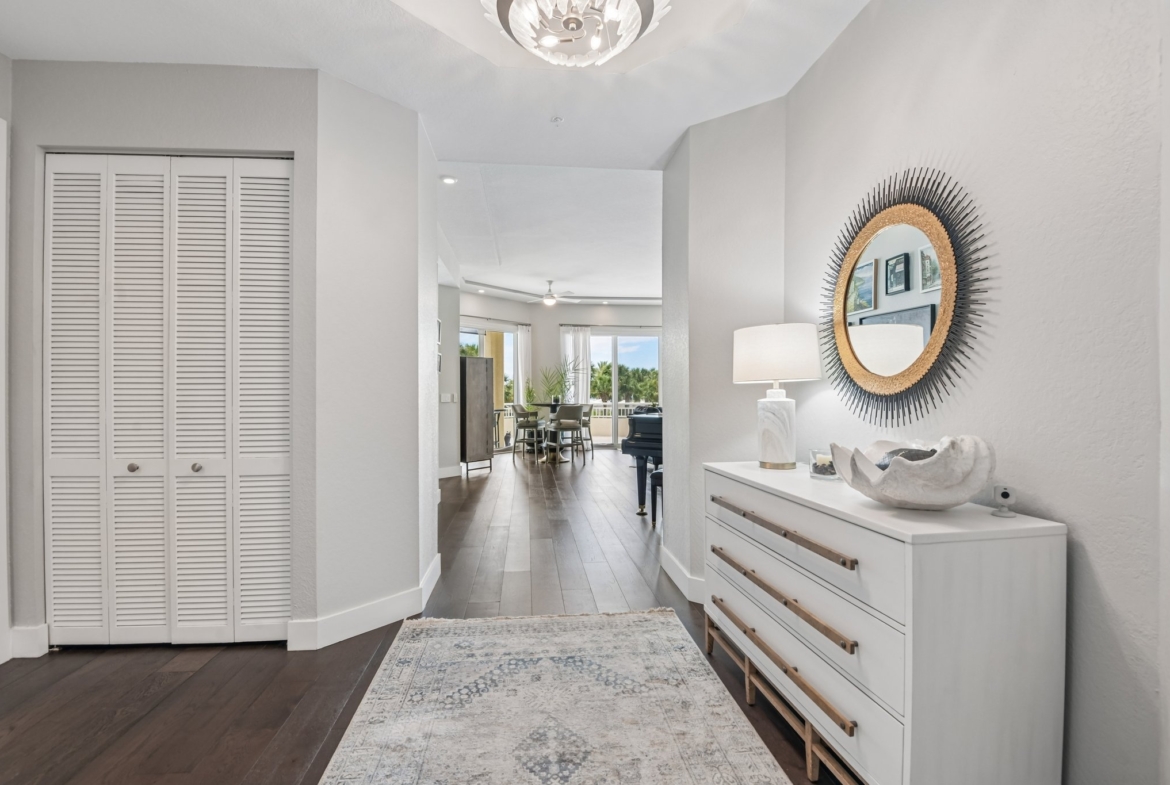 Dramatic foyer with engineered hardwood floors and 8-foot doors at 1180 Gulf Blvd #101, Clearwater Beach FL