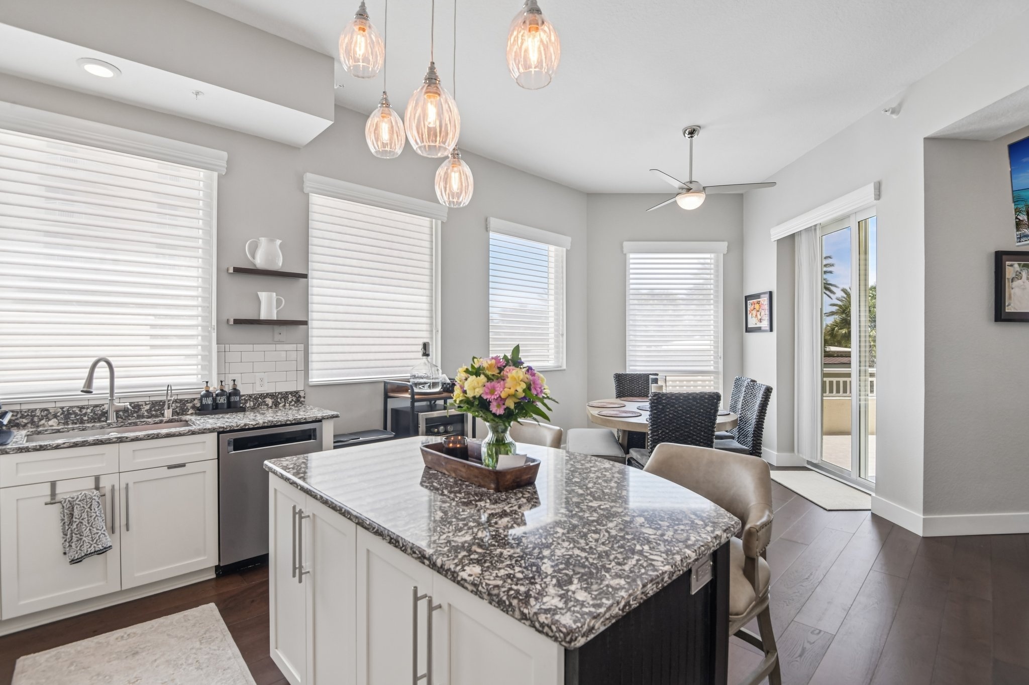 Kitchen island with pendant lighting and eat-in seating in this 3 bedroom Clearwater Beach condo for sale