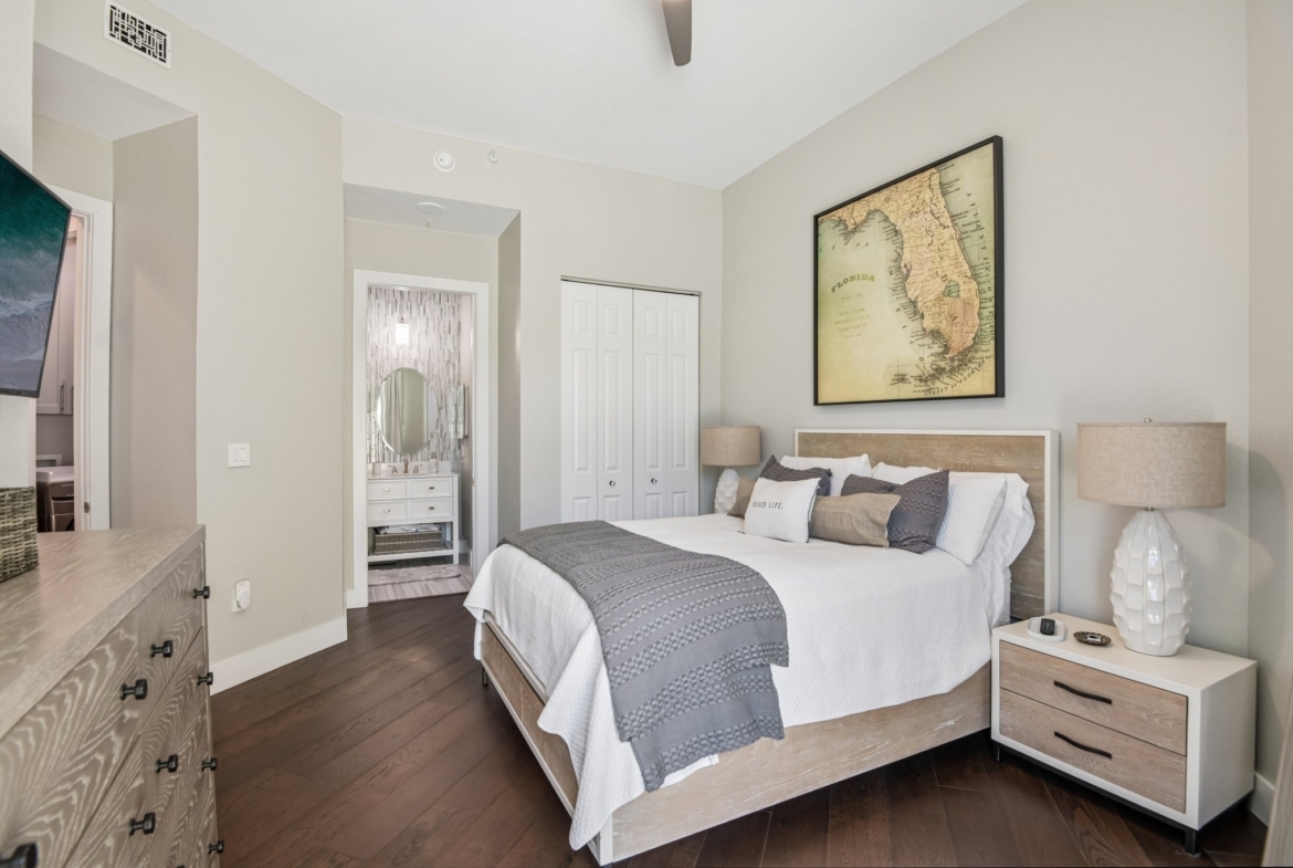 Owner's suite with dual custom-organized dressing rooms at The Grande on Sand Key residence 101