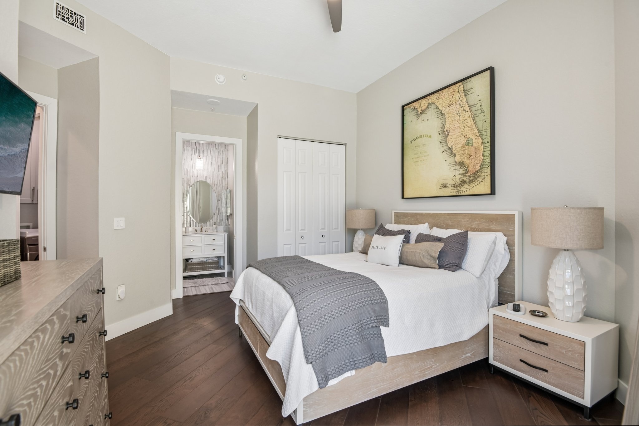 Owner's suite with dual custom-organized dressing rooms at The Grande on Sand Key residence 101