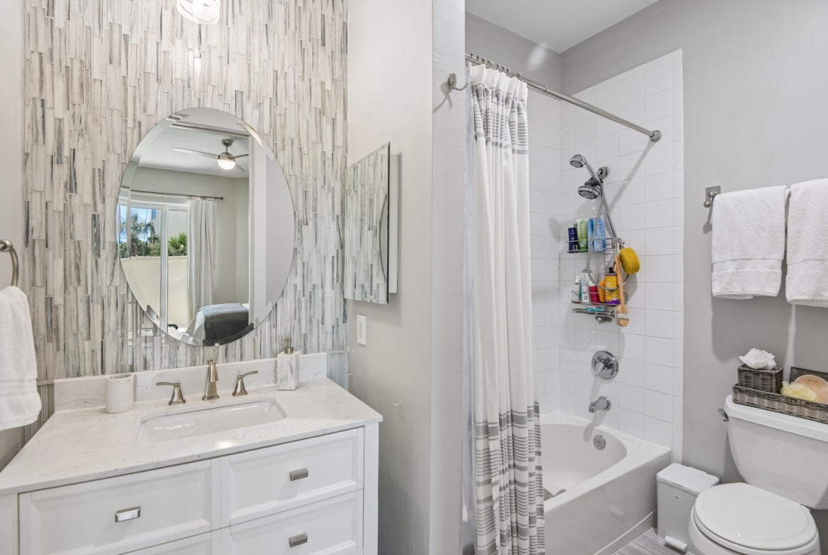 Walk-in shower in the primary bathroom at 1180 Gulf Blvd #101, The Grande on Sand Key, Clearwater Beach FL
