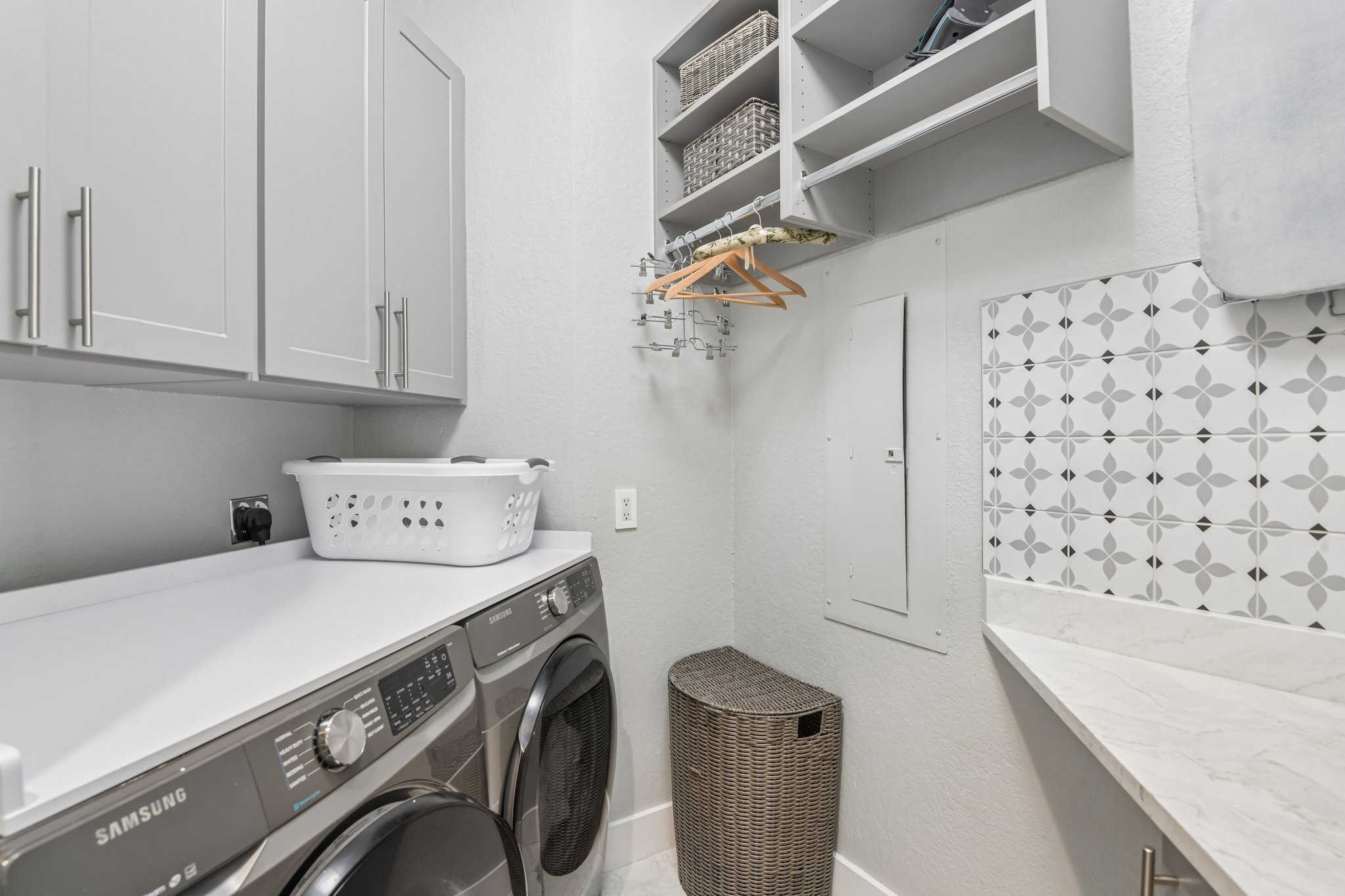 Butler's pantry with wine refrigerator and built-in features at The Grande on Sand Key residence 101