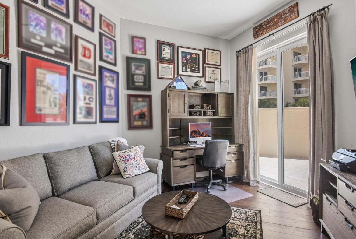 Den and home office with built-in features at The Grande on Sand Key residence 101, Clearwater Beach FL