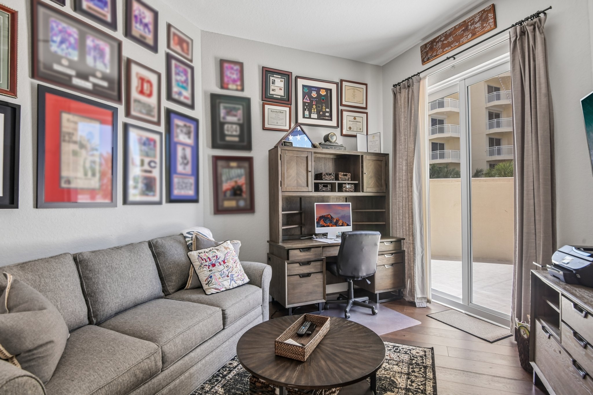 Den and home office with built-in features at The Grande on Sand Key residence 101, Clearwater Beach FL