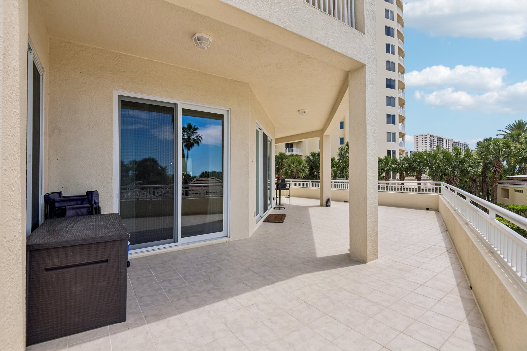 Terrace access through sliding glass doors from the living area at The Grande on Sand Key residence 101