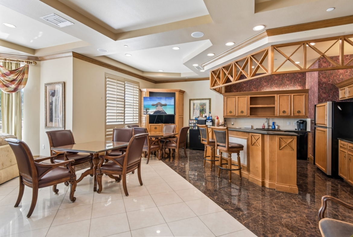 Card room and catering kitchen in the Sunset Room social suites at The Grande on Sand Key