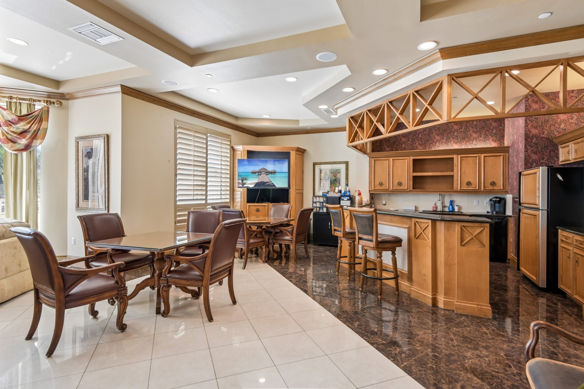 Card room and catering kitchen in the Sunset Room social suites at The Grande on Sand Key