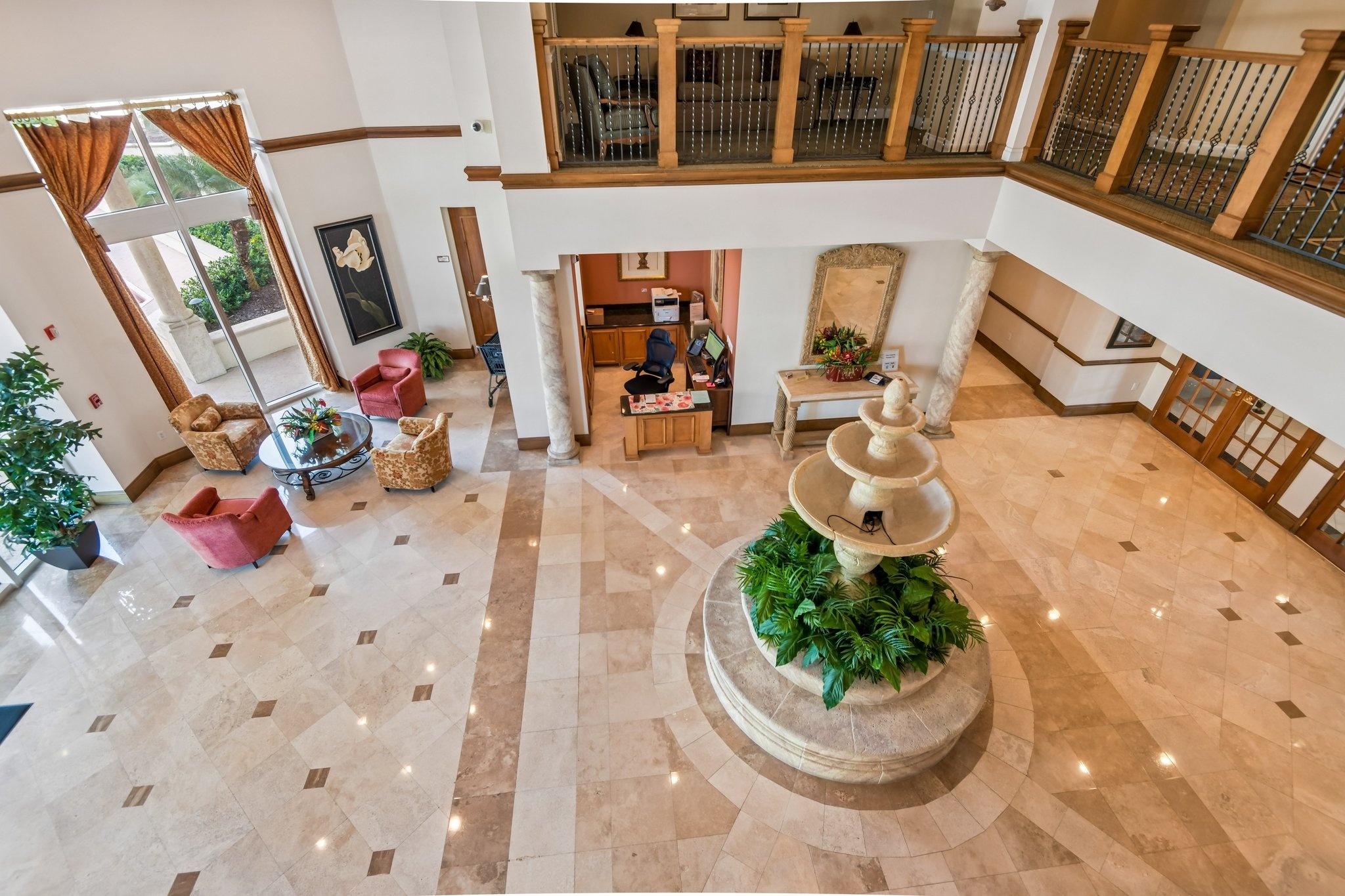 Grand lobby with fountain and 24-hour gated security at The Grande on Sand Key, Clearwater Beach FL