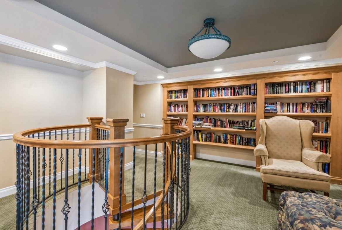 Library with spiral staircase at The Grande on Sand Key, Clearwater Beach FL
