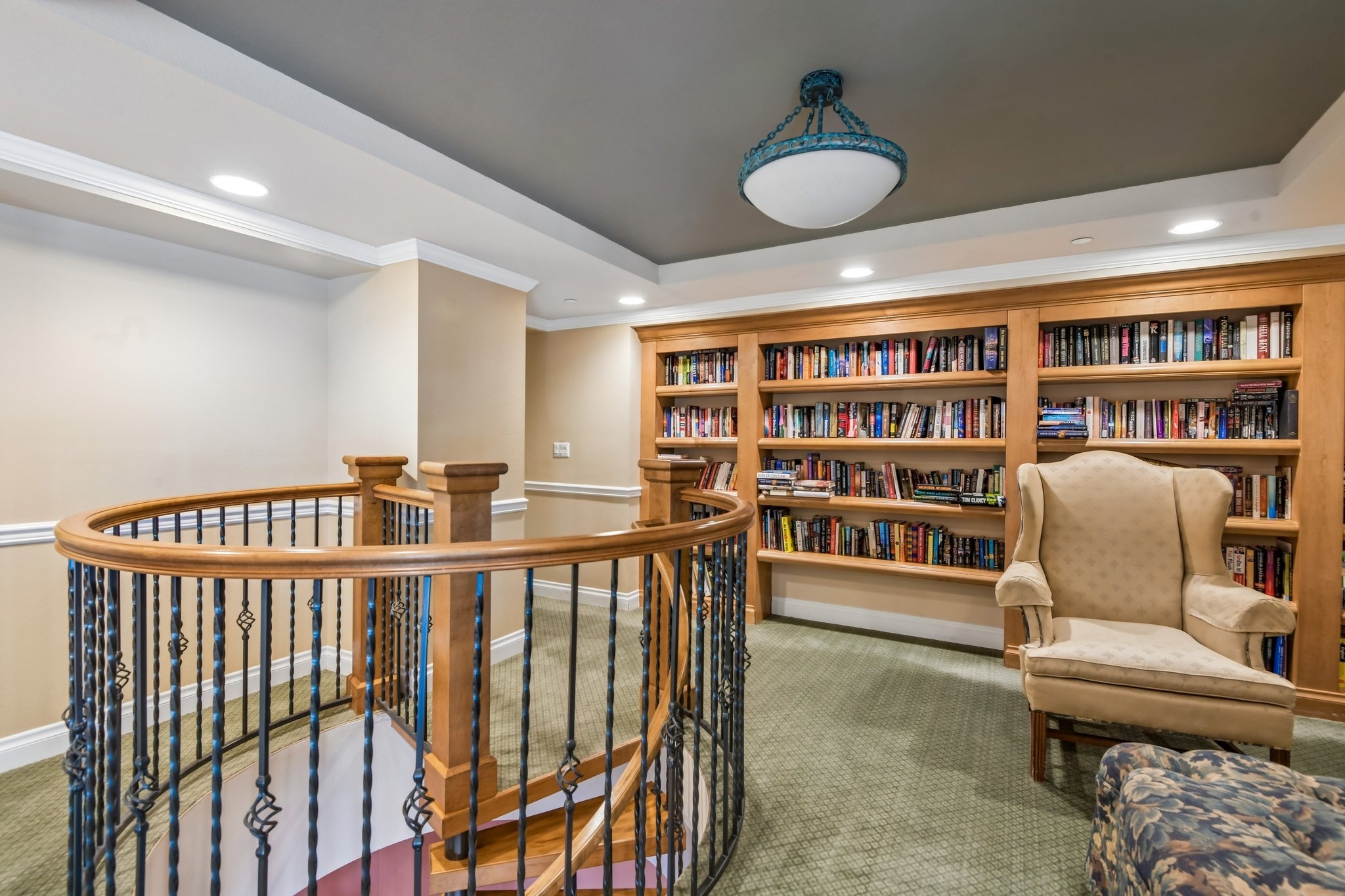 Library with spiral staircase at The Grande on Sand Key, Clearwater Beach FL