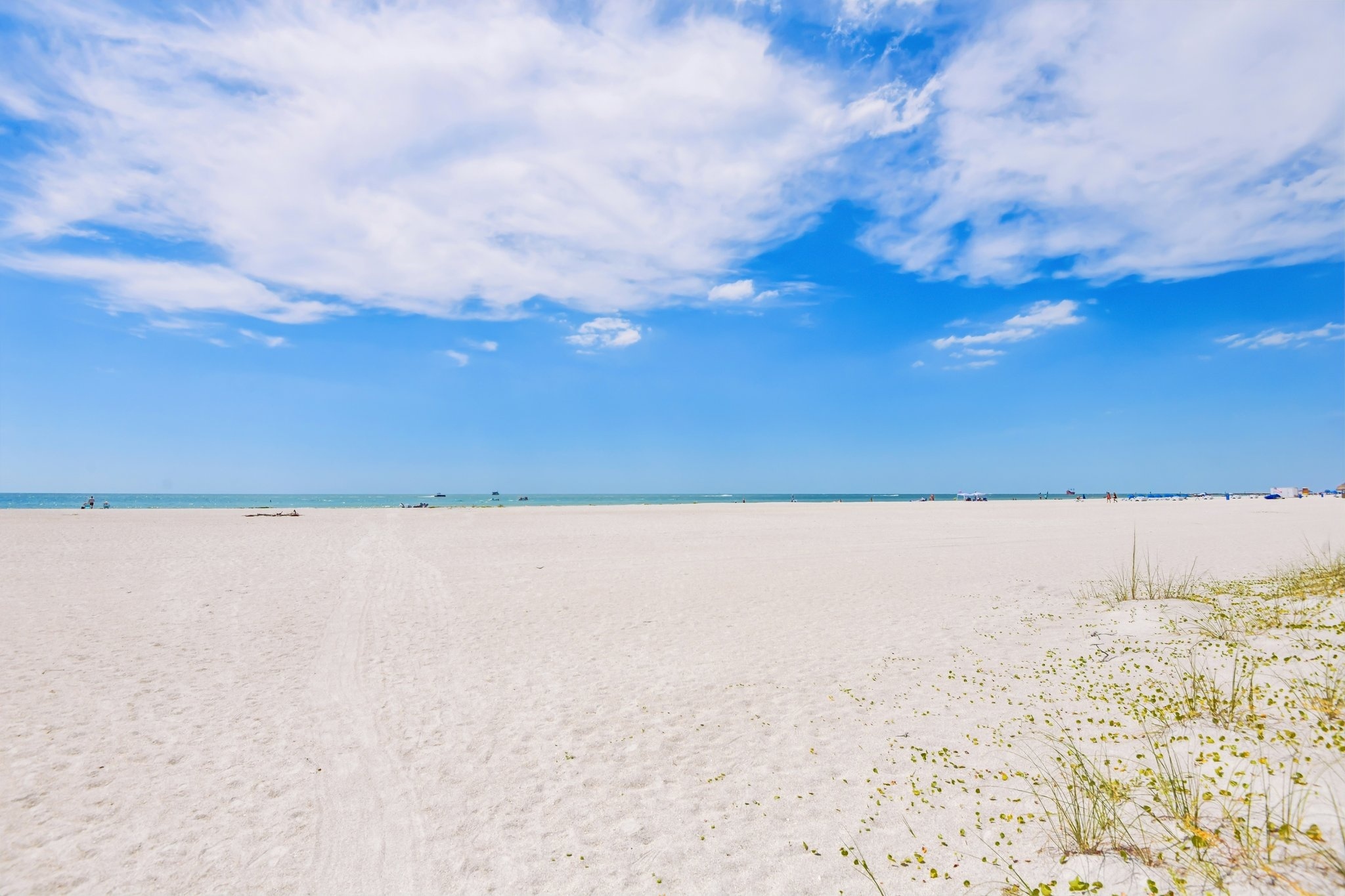 Sugar-white sand and Gulf of Mexico water at Sand Key Beach, Clearwater Beach FL 33767