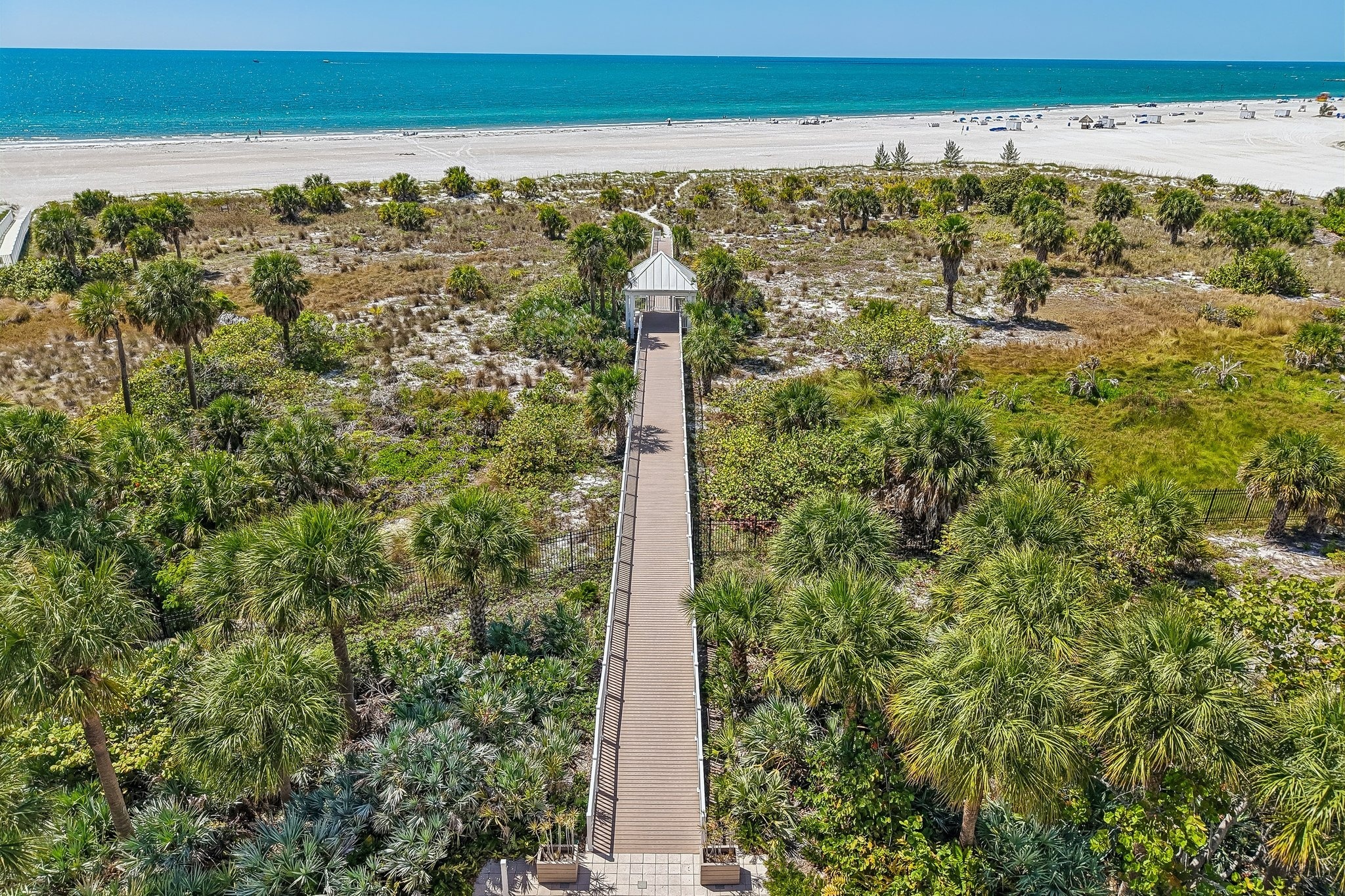 Aerial of the private beach boardwalk at The Grande on Sand Key, Clearwater Beach FL