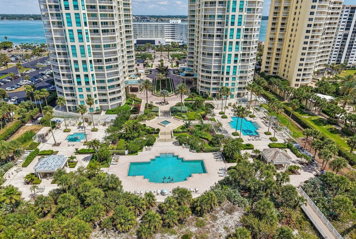 Aerial of The Grande on Sand Key towers along the Gulf of Mexico in Clearwater Beach FL