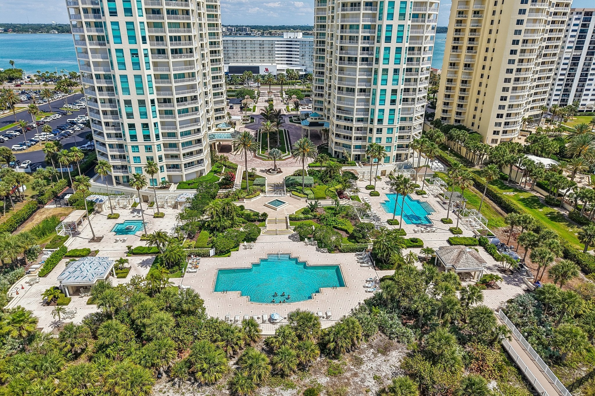 Aerial of The Grande on Sand Key towers along the Gulf of Mexico in Clearwater Beach FL