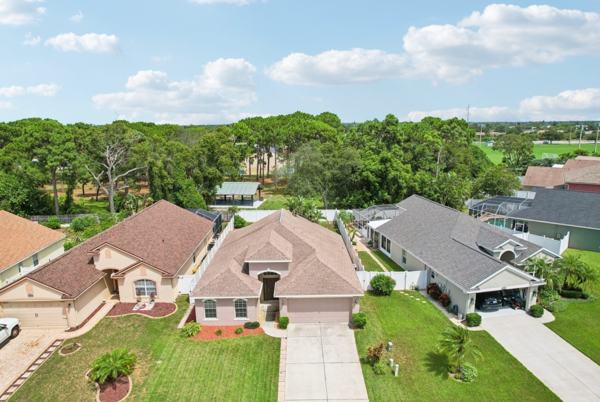 Aerial view of 2638 Big Pine Dr showing the home, fenced yard and Key Vista neighborhood in Holiday FL