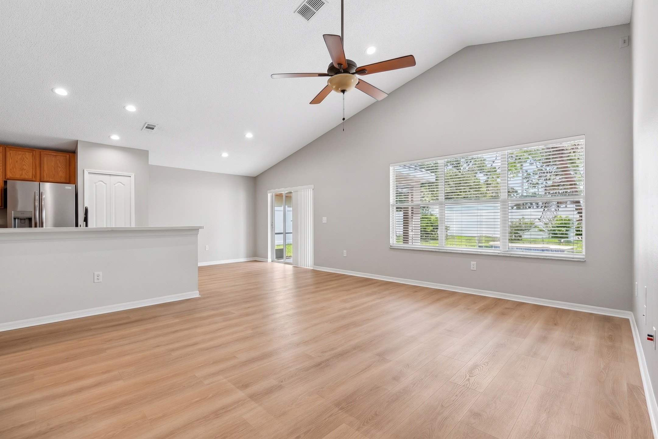 Open living area with vaulted ceilings and abundant natural light at 2638 Big Pine Dr, Holiday FL