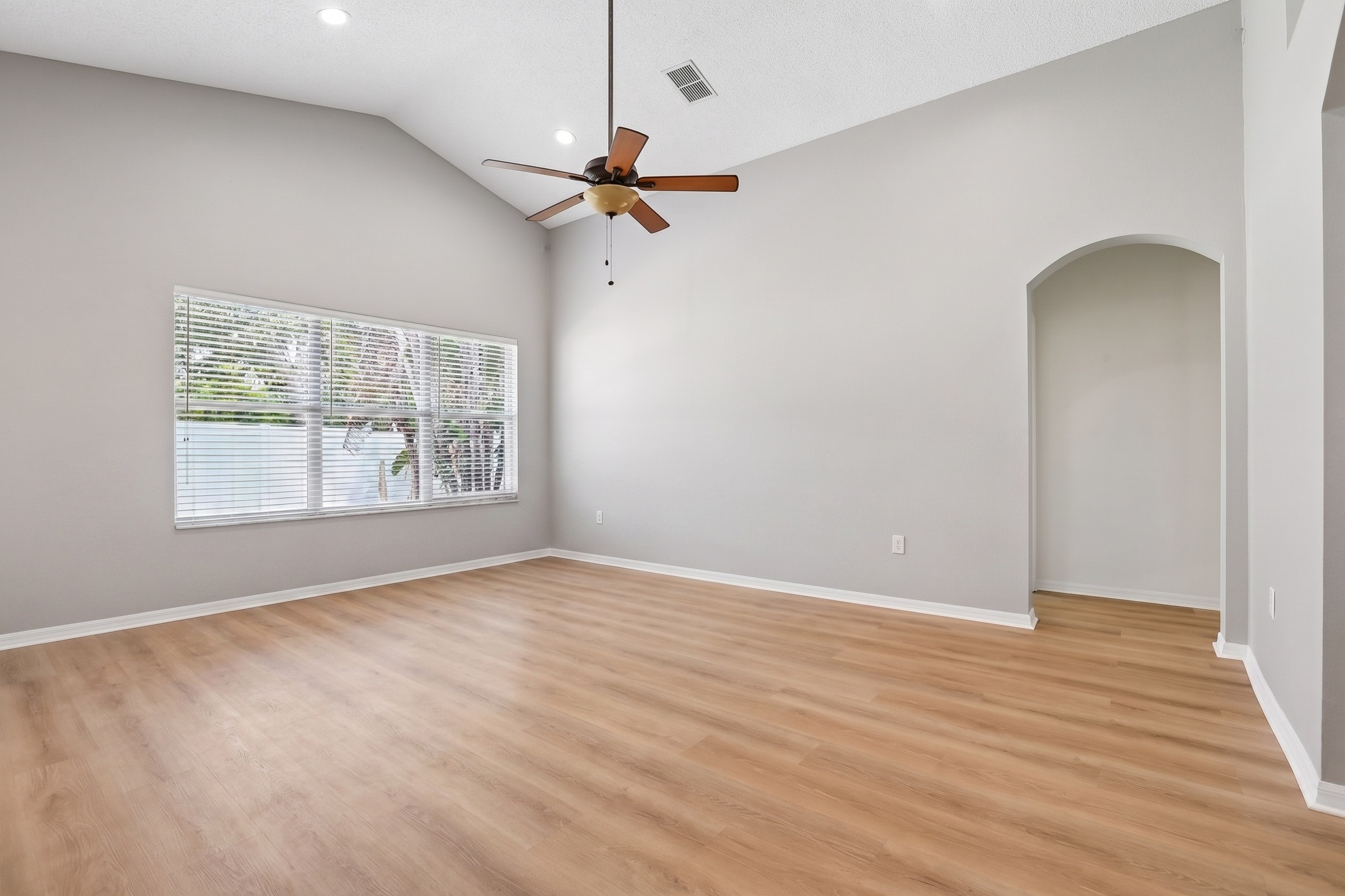 Great room with high ceilings and luxury vinyl plank flooring at 2638 Big Pine Dr, Holiday FL 34691