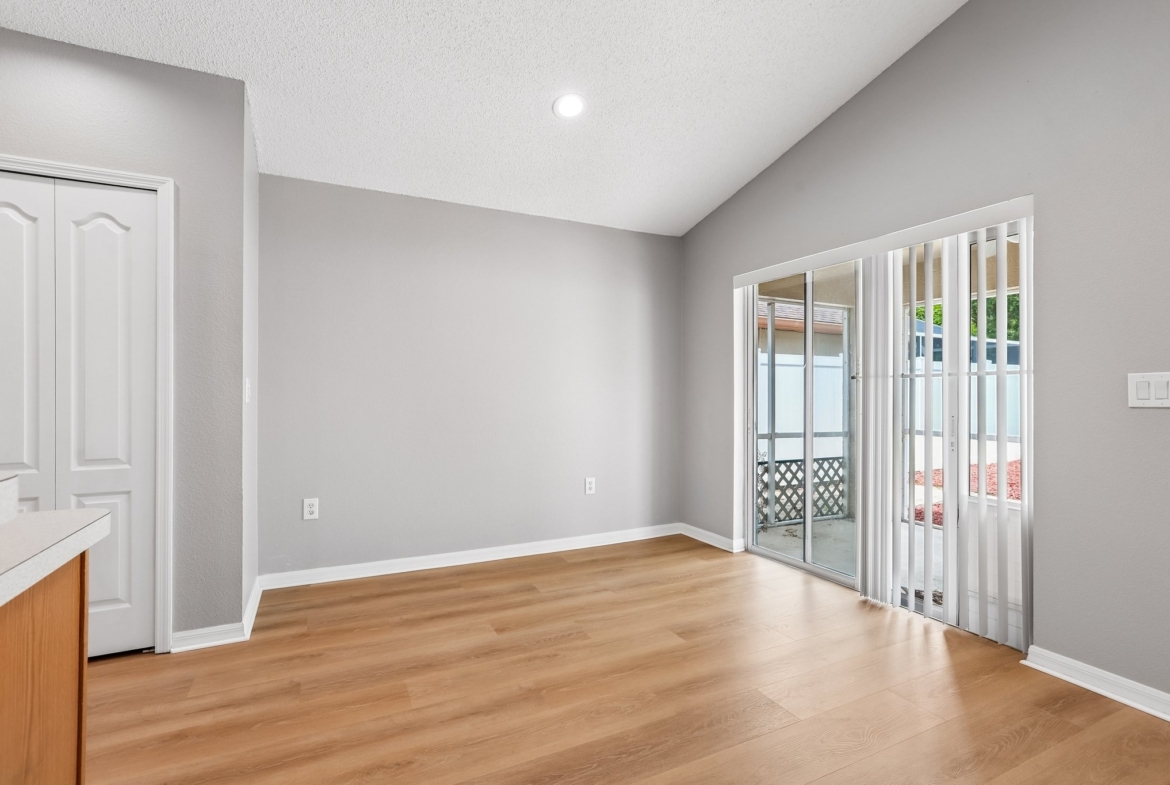 Dining room with French doors to the screened lanai at 2638 Big Pine Dr in Key Vista, Holiday FL