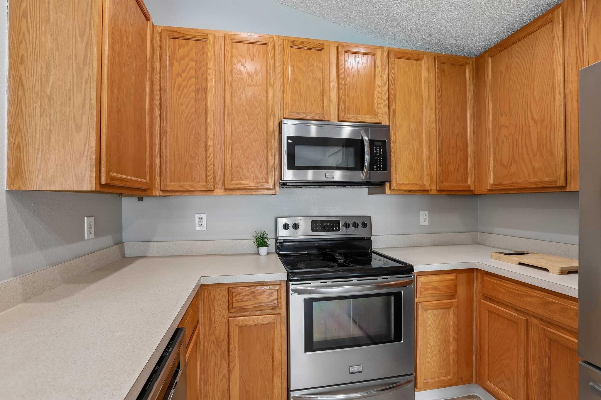 Kitchen with stainless steel range, microwave and ample cabinetry at 2638 Big Pine Dr, Holiday FL
