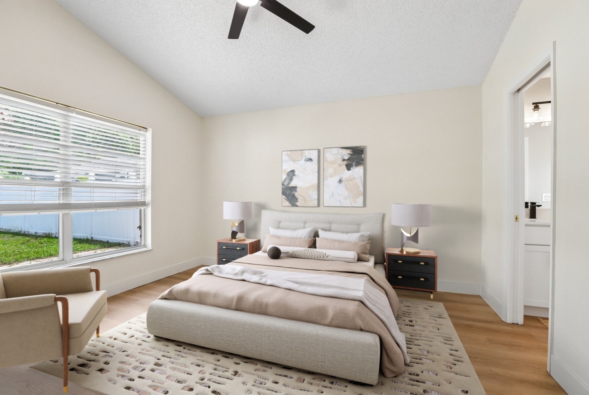 Virtually staged primary bedroom with ceiling fan at 2638 Big Pine Dr, Holiday FL 34691