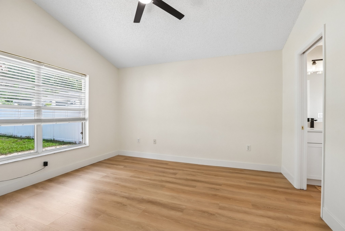 Large primary suite with vaulted ceiling and walk in closet at 2638 Big Pine Dr in Key Vista, Holiday FL