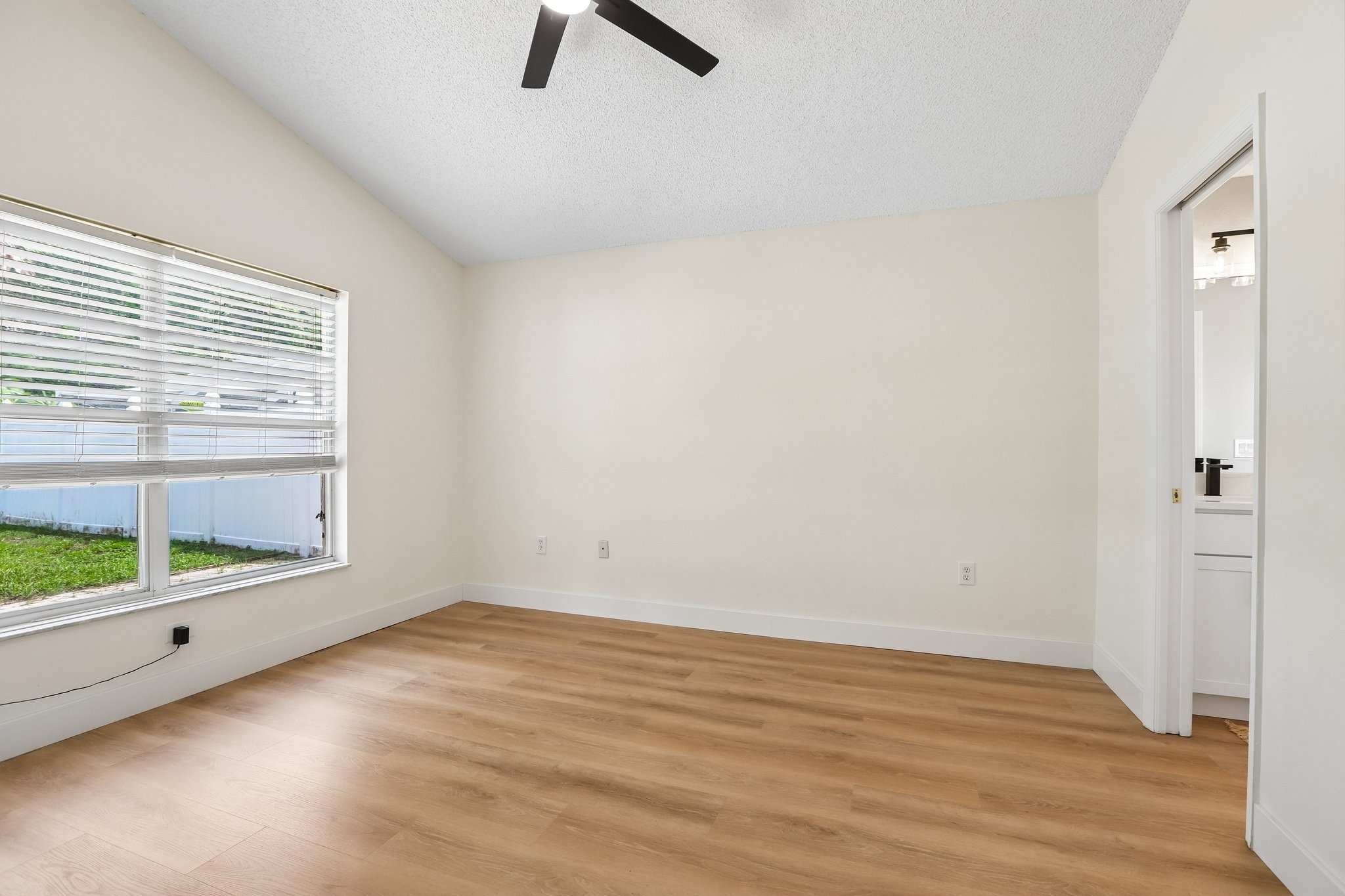 Large primary suite with vaulted ceiling and walk in closet at 2638 Big Pine Dr in Key Vista, Holiday FL