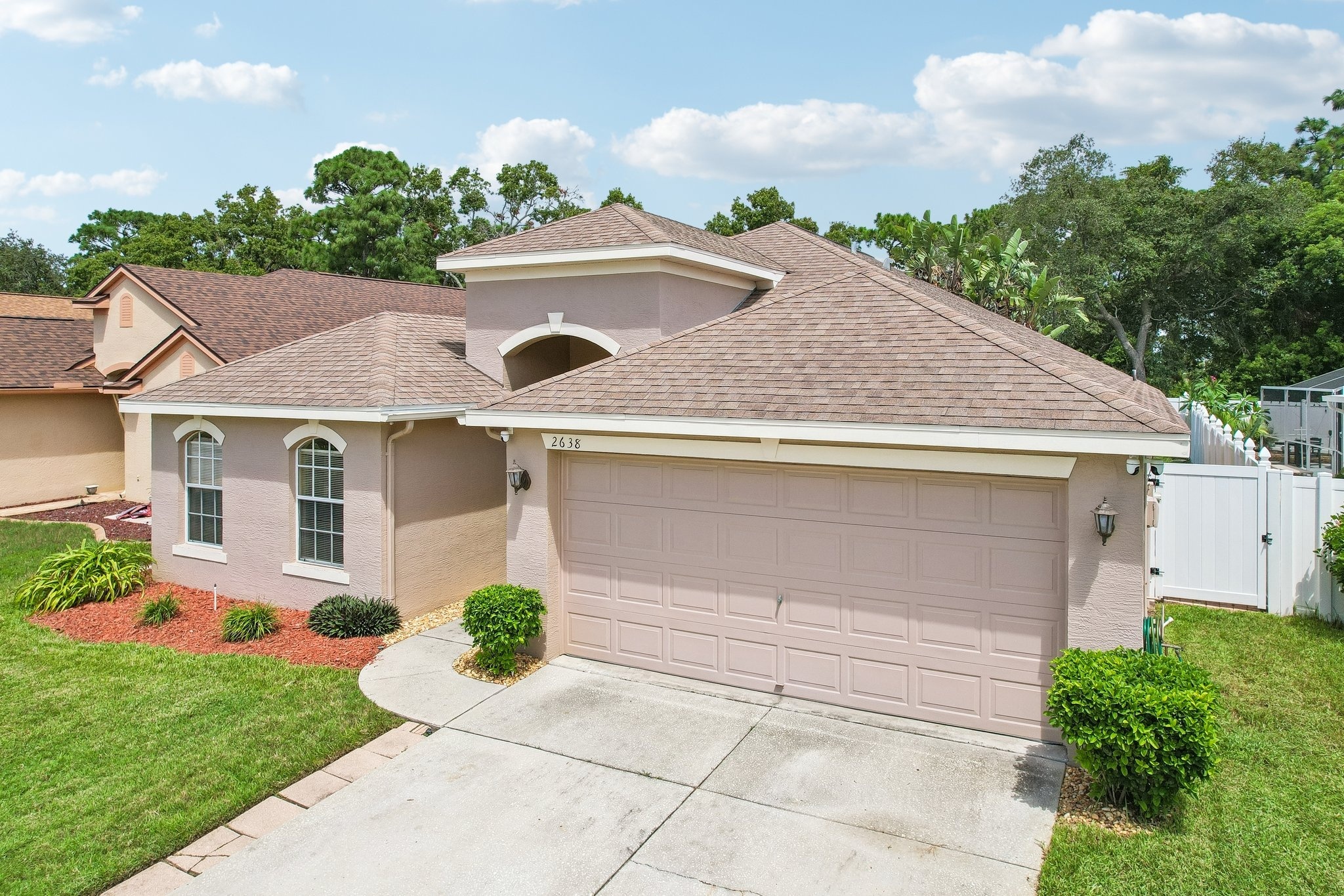 Two car attached garage and driveway at 2638 Big Pine Dr, Holiday FL 34691