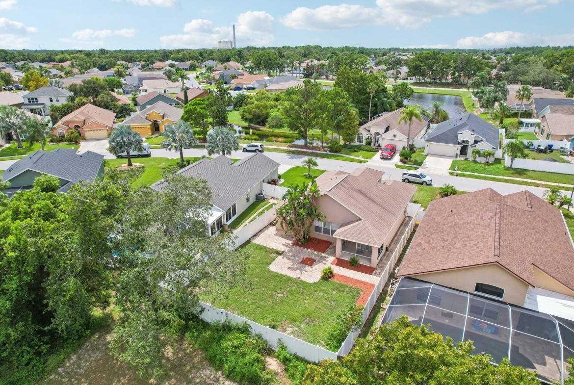 Aerial view of the home and fenced backyard at 2638 Big Pine Dr, Holiday FL