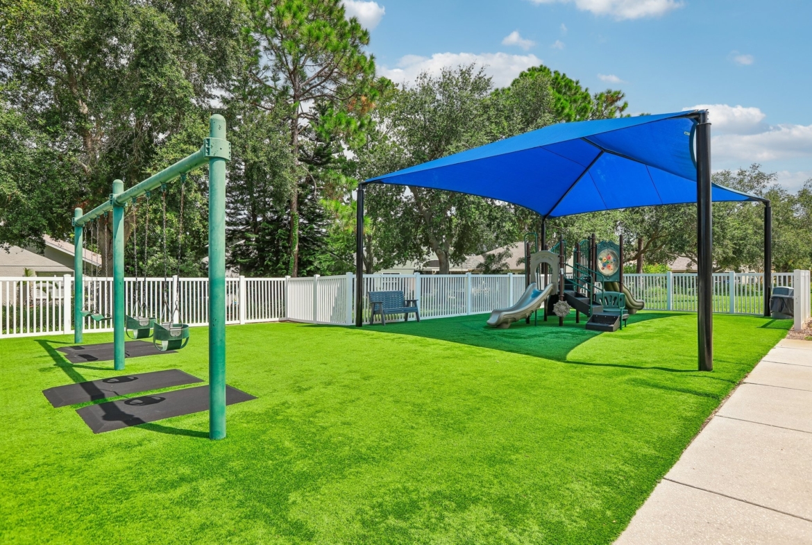 Key Vista community playground with shaded play area in Holiday FL